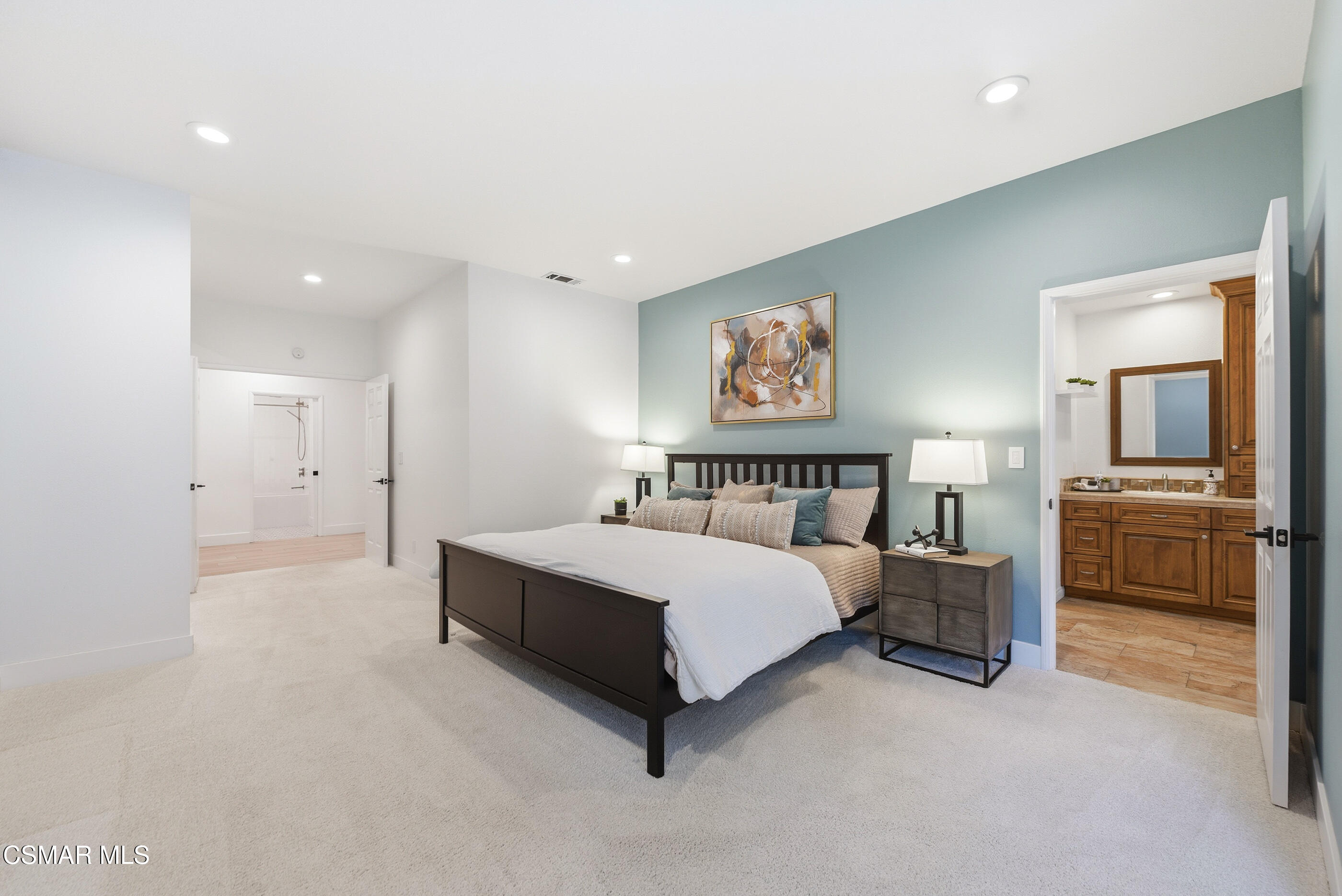 2810 Rikkard Drive Thousand Oaks, CA 91362 - Photo 24 of 38 a spacious bedroom with a bed and a view of kitchen