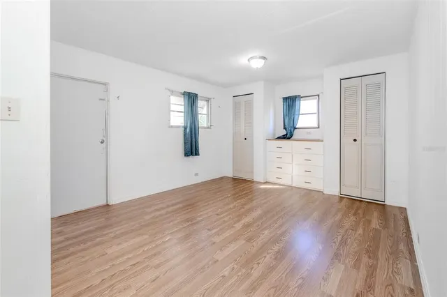 wooden floor with white walls