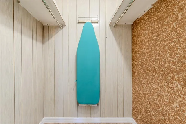 a bed room with a bed and a chair