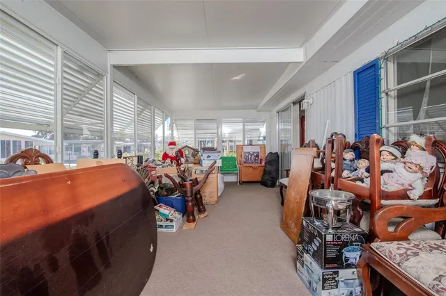 a bedroom with furniture and a chandelier