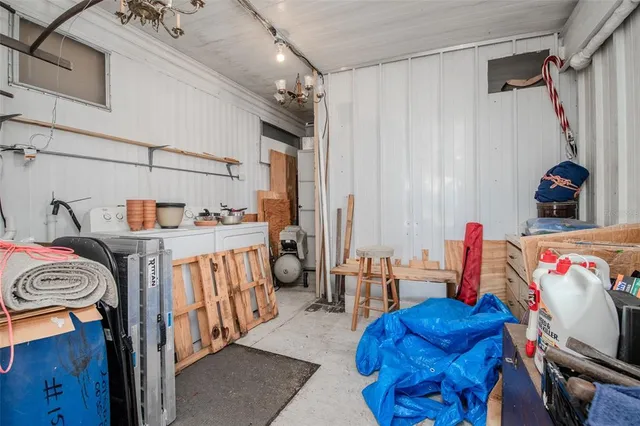 a kitchen with stainless steel appliances granite countertop a sink and a refrigerator