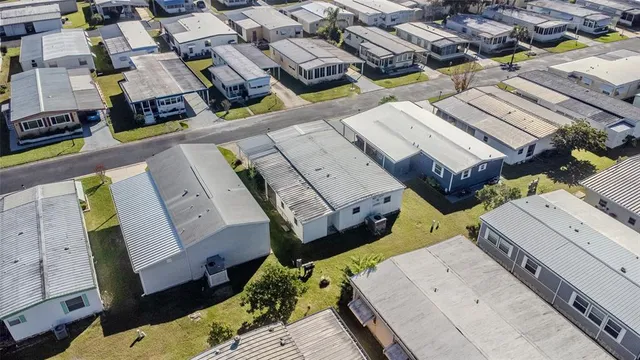an aerial view of a house with a ocean view
