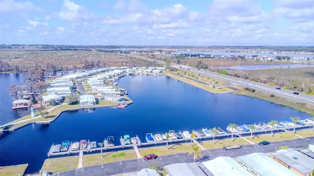 an aerial view of a residential building and lake view