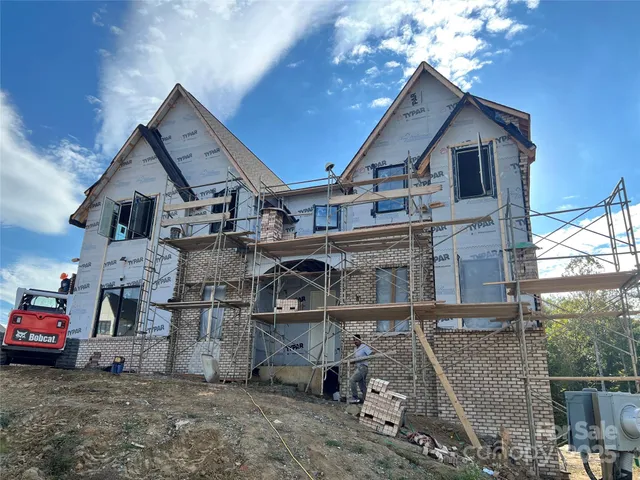 a view of a car park in front of house