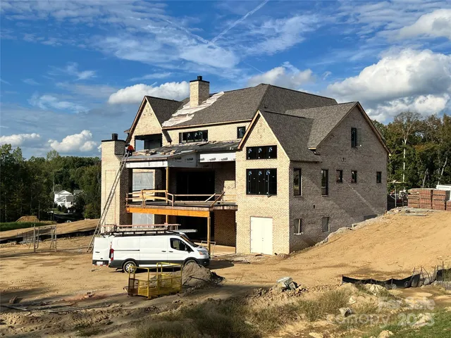 a view of residential houses with wooden walls