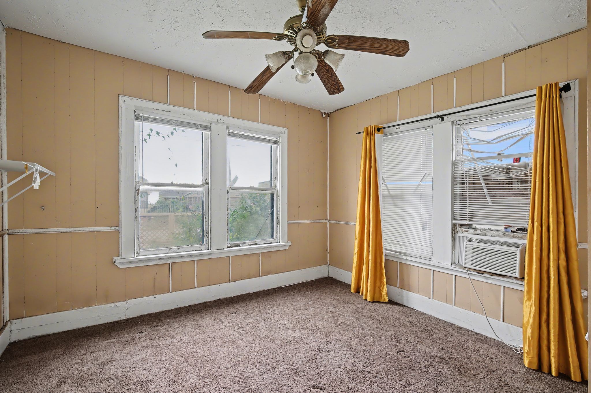 1222 Genova Street Houston, TX 77009 - Photo 11 of 15 wooden floor in an empty room with a window