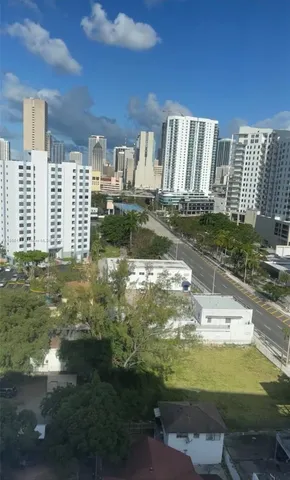 a view of a water fountain in front of a building
