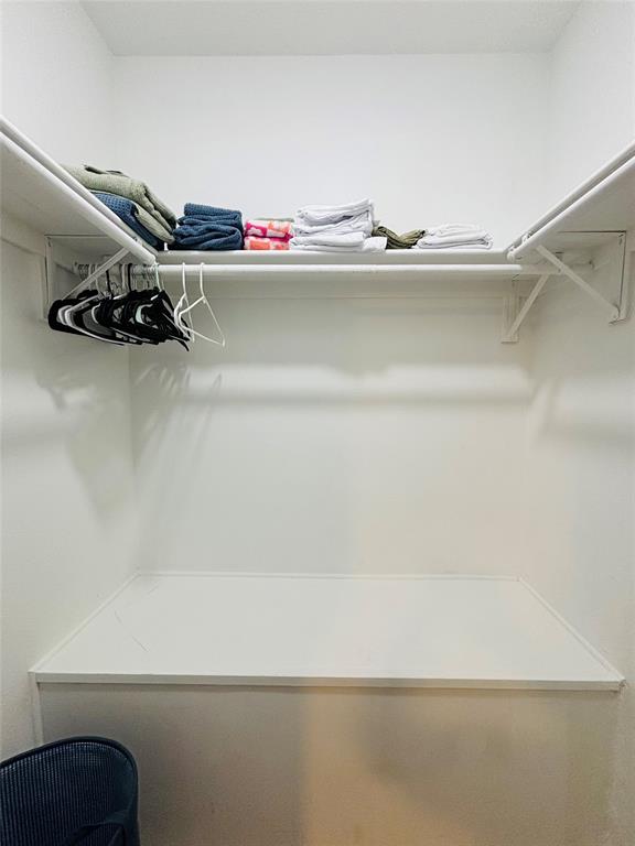 14277 Preston Road, Unit 416 Dallas, TX 75254 - Photo 18 of 40 Built-in closet system featuring white shelving and hanging rods