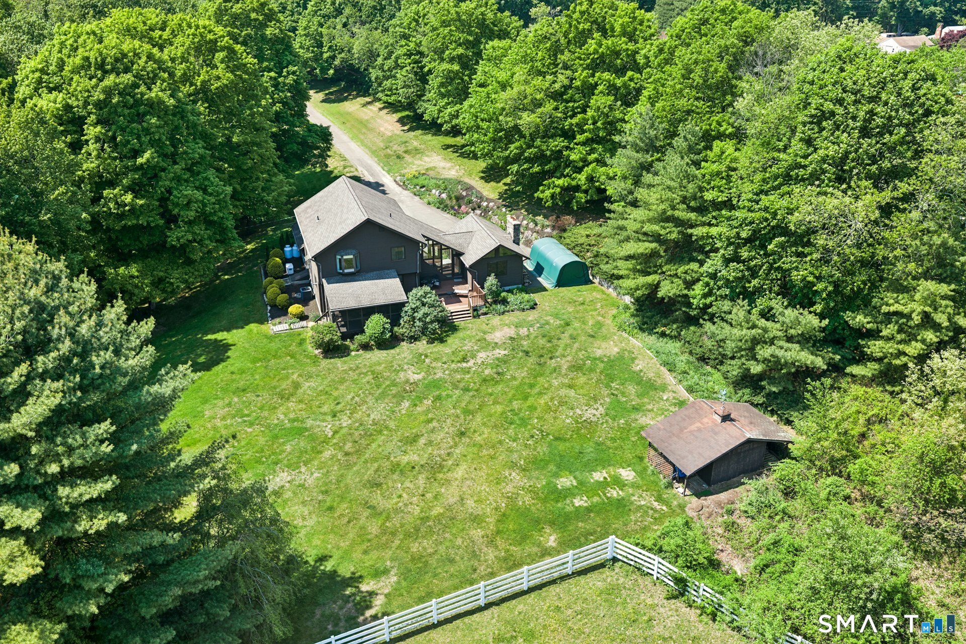 127 Huntingtown Road Newtown, CT 06470 - Photo 32 of 38 a backyard of a house with lots of green space