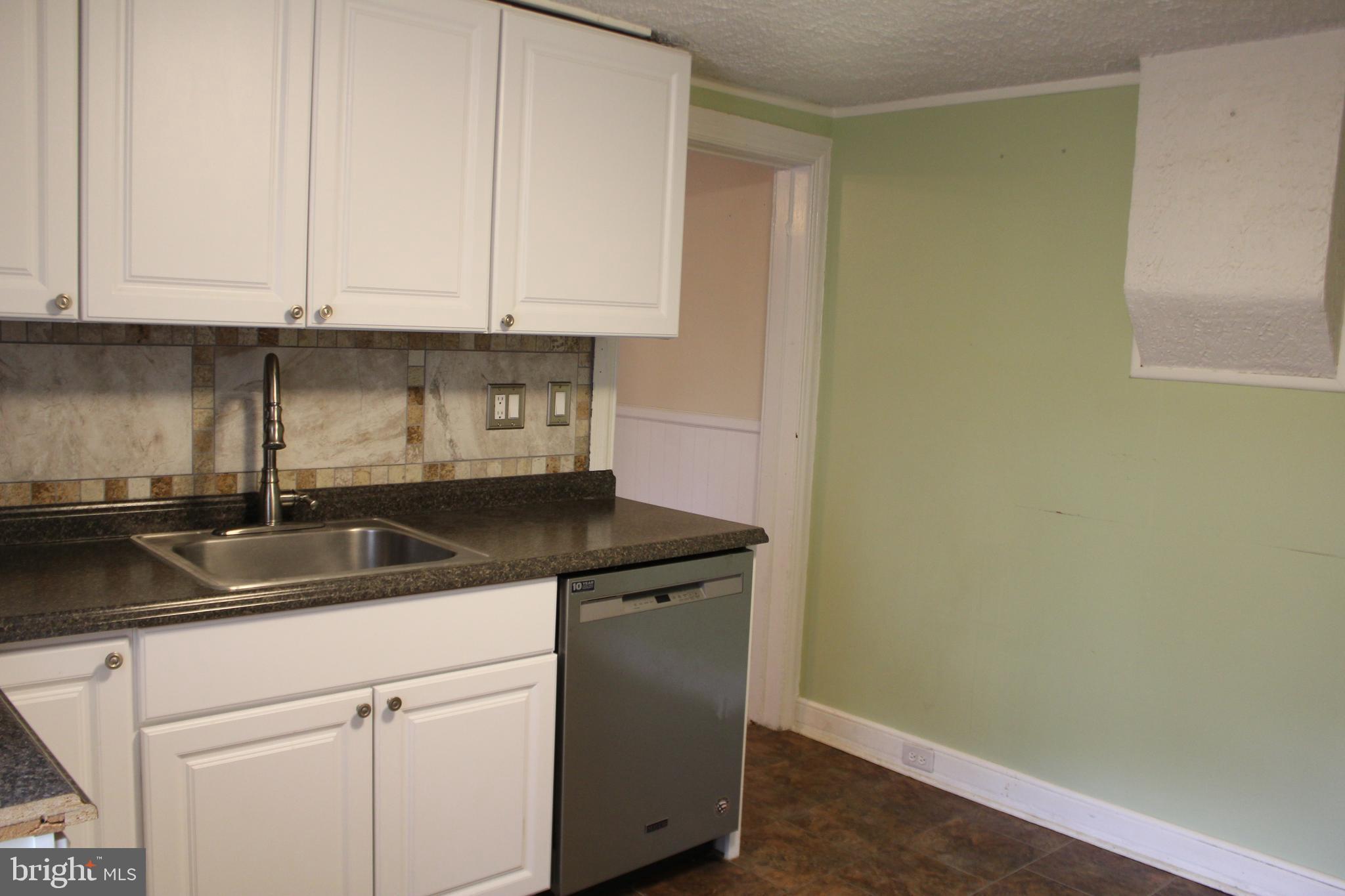 72 Sproul Road Malvern, PA 19355 - Photo 11 of 31 a kitchen with a sink and cabinets