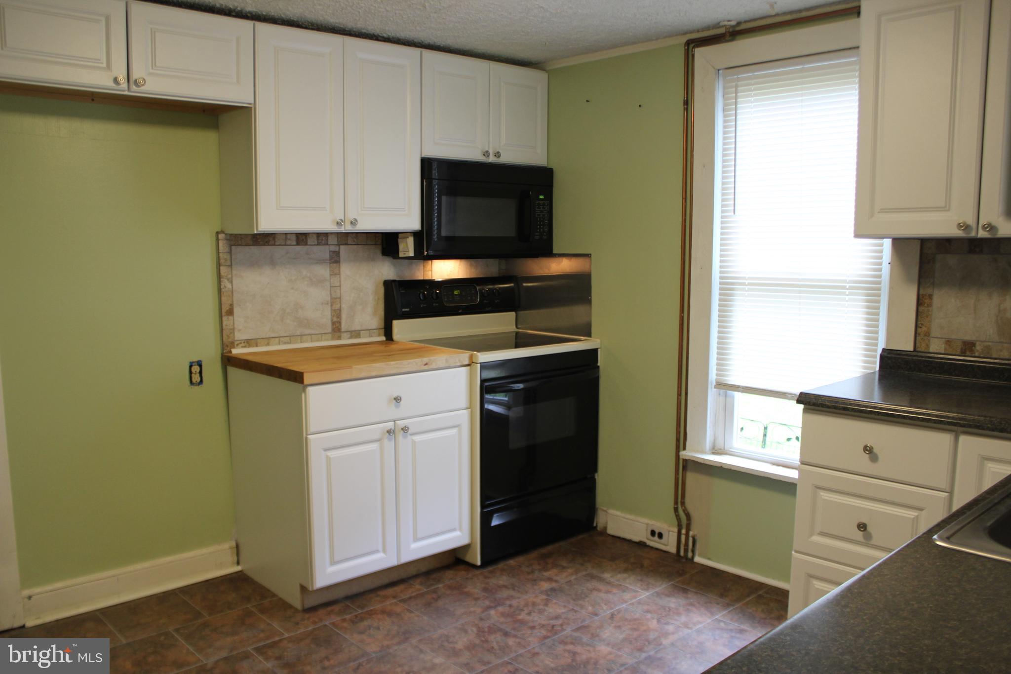 72 Sproul Road Malvern, PA 19355 - Photo 12 of 31 a kitchen with a sink and a stove top oven