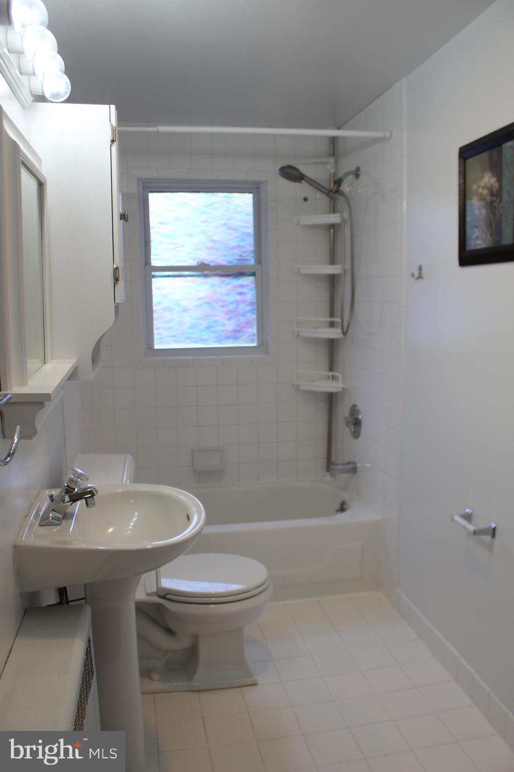 72 Sproul Road Malvern, PA 19355 - Photo 17 of 31 a bathroom with a sink a toilet and shower