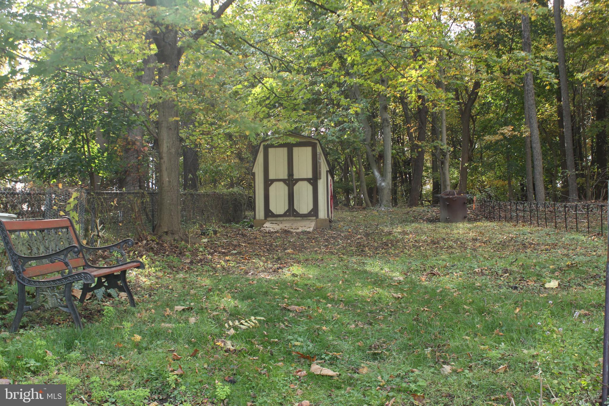 72 Sproul Road Malvern, PA 19355 - Photo 30 of 31 a backyard of a house with table and chairs