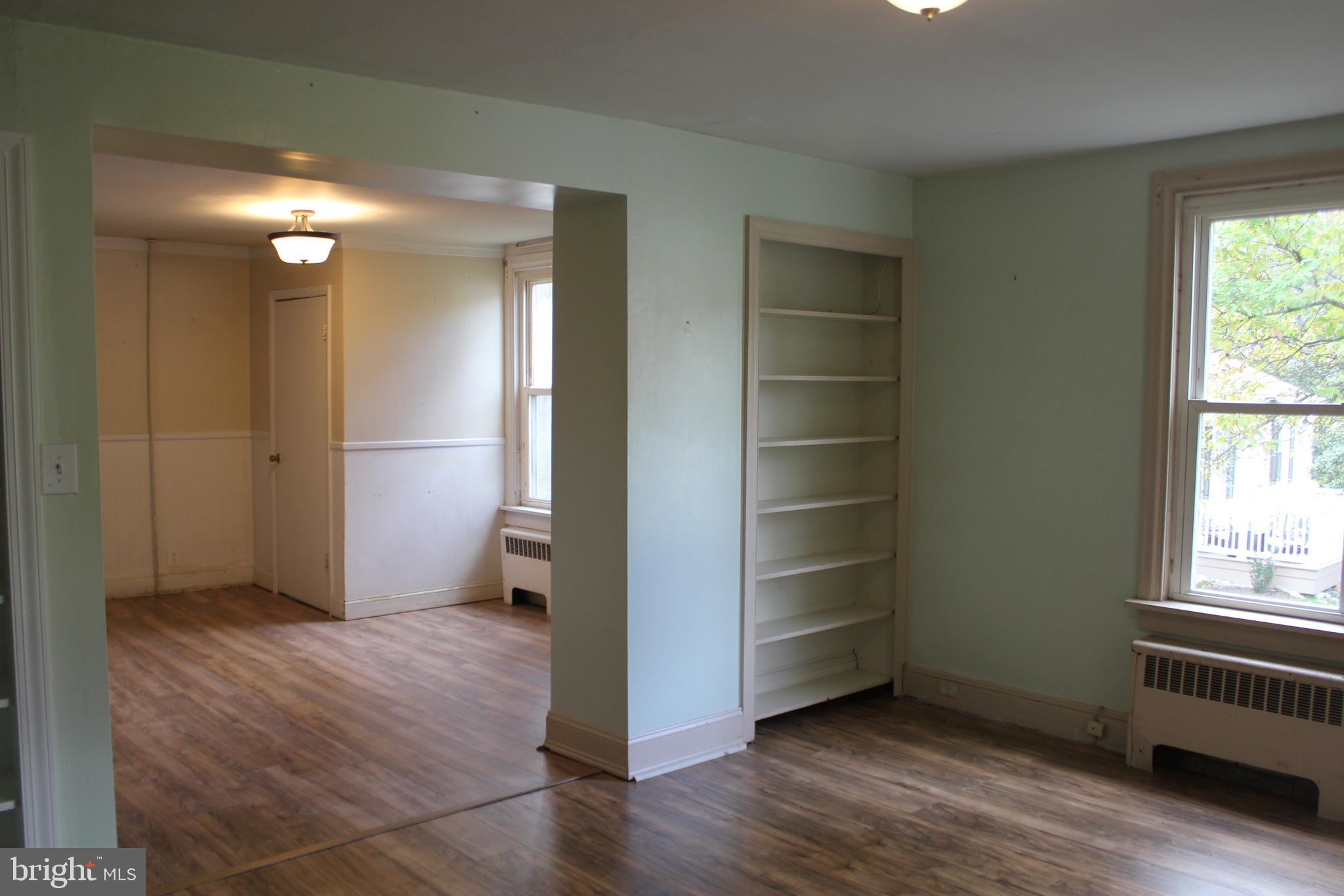 72 Sproul Road Malvern, PA 19355 - Photo 3 of 31 an empty room with wooden floor cabinet and windows