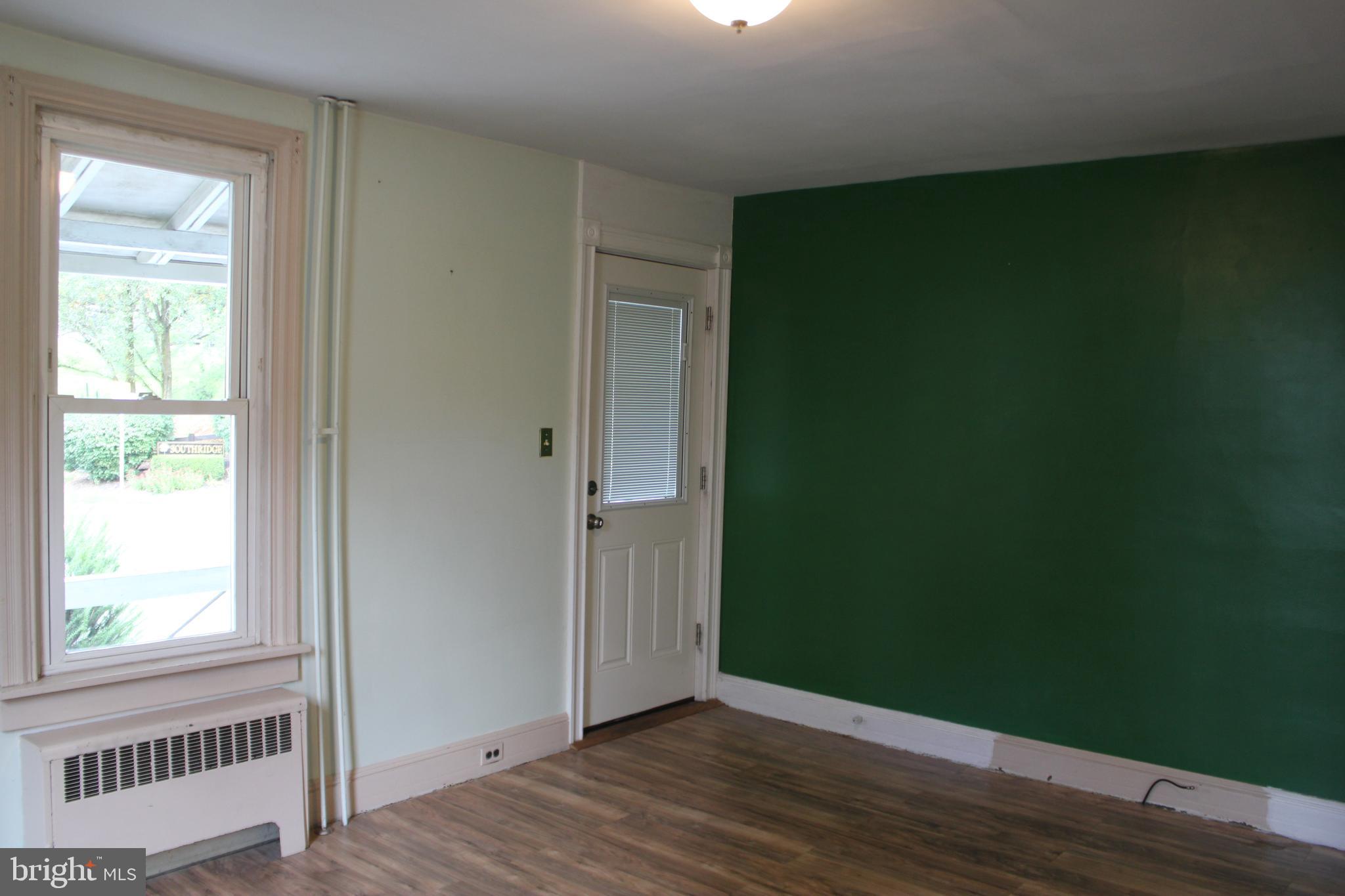 72 Sproul Road Malvern, PA 19355 - Photo 5 of 31 an empty room with wooden floor and a window