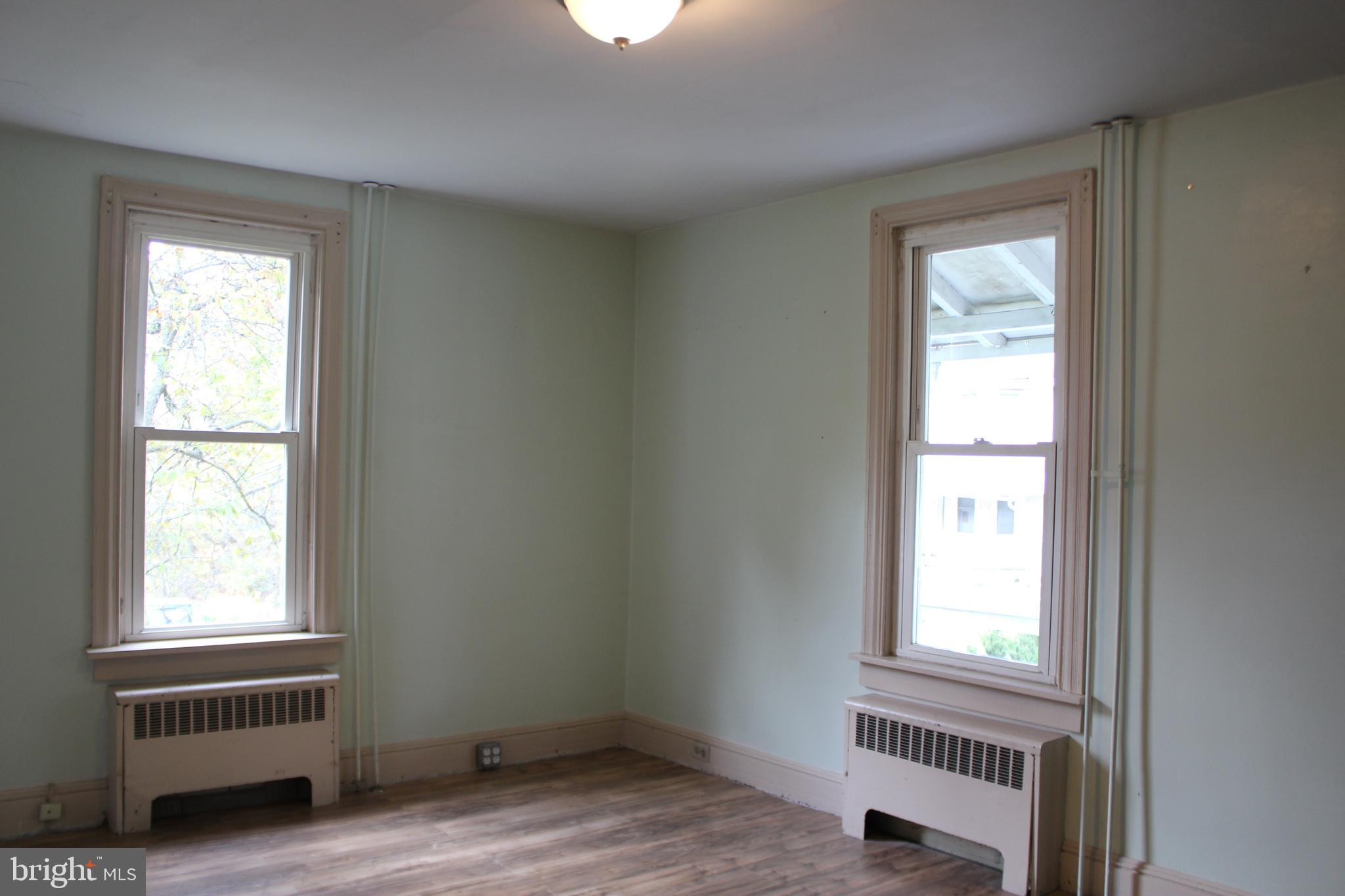 72 Sproul Road Malvern, PA 19355 - Photo 6 of 31 a view of an empty room with a window