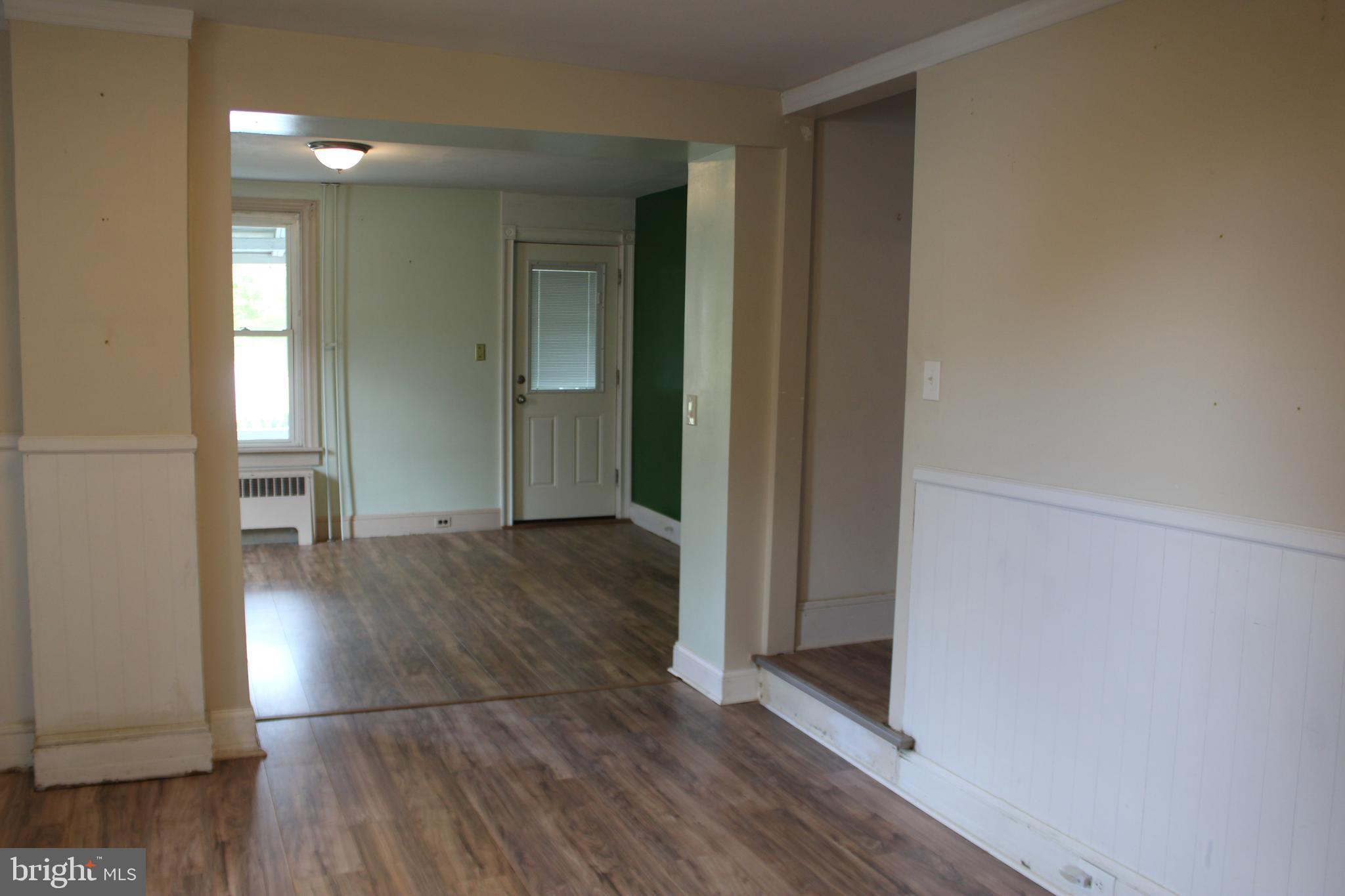 72 Sproul Road Malvern, PA 19355 - Photo 7 of 31 an empty room with wooden floor and windows