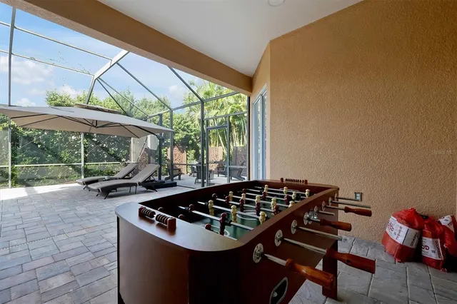 a view of a workspace with furniture and wooden floor