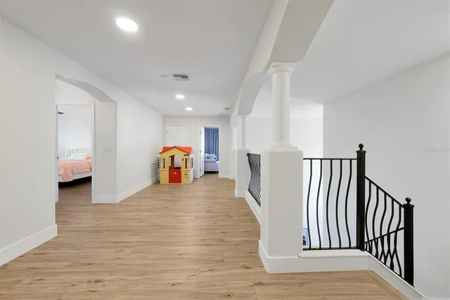 a view of a house with garden and trees