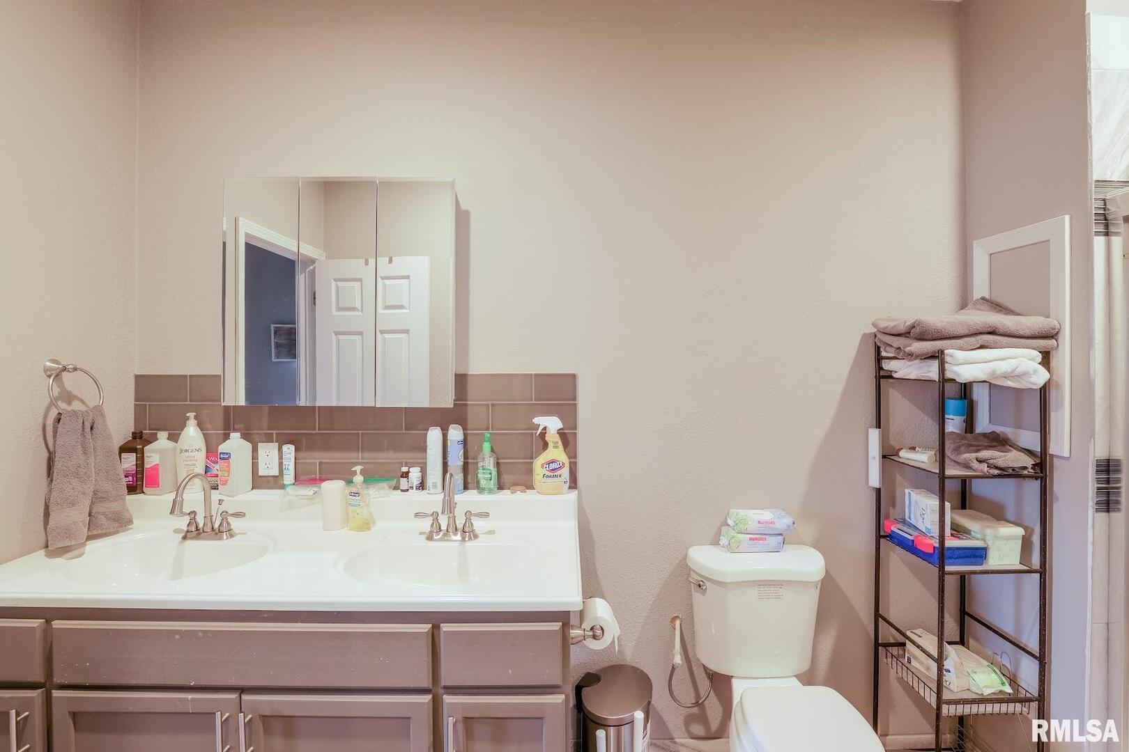 0 Bolen Store Road Thompsonville, IL 62890 - Photo 24 of 52 a bathroom with a sink vanity mirror and toilet