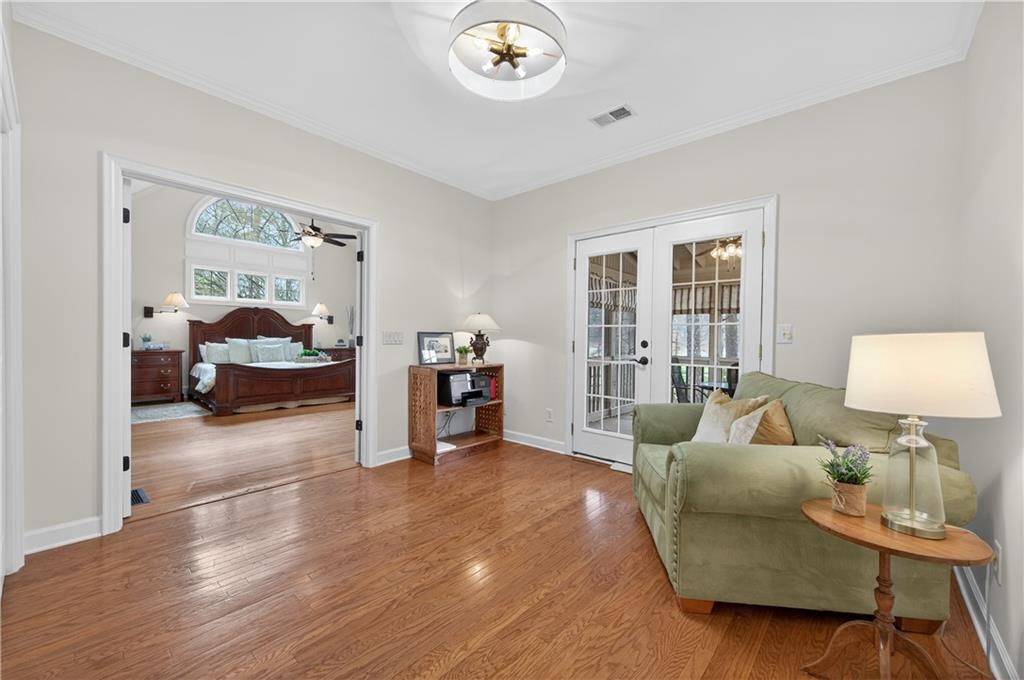 6460 Rutherford Place Suwanee, GA 30024 - Photo 13 of 35 a living room with furniture and a table