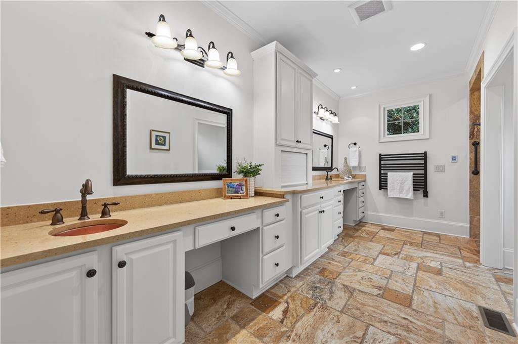 6460 Rutherford Place Suwanee, GA 30024 - Photo 14 of 35 a spacious bathroom with a double vanity sink mirror and
