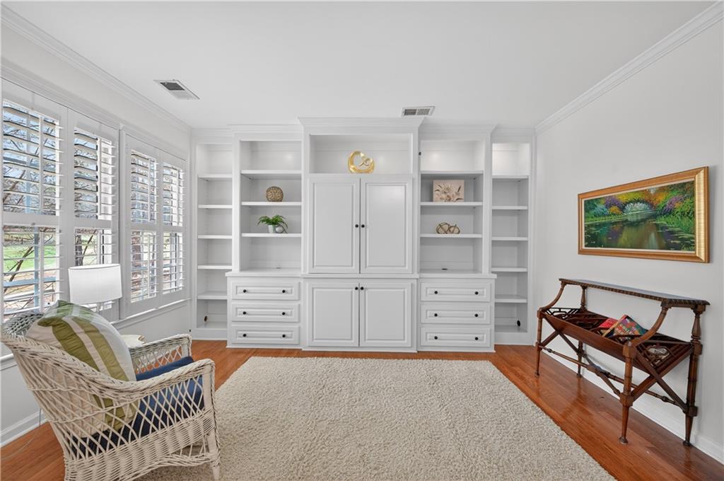 6460 Rutherford Place Suwanee, GA 30024 - Photo 15 of 35 a view of a bedroom with furniture and windows