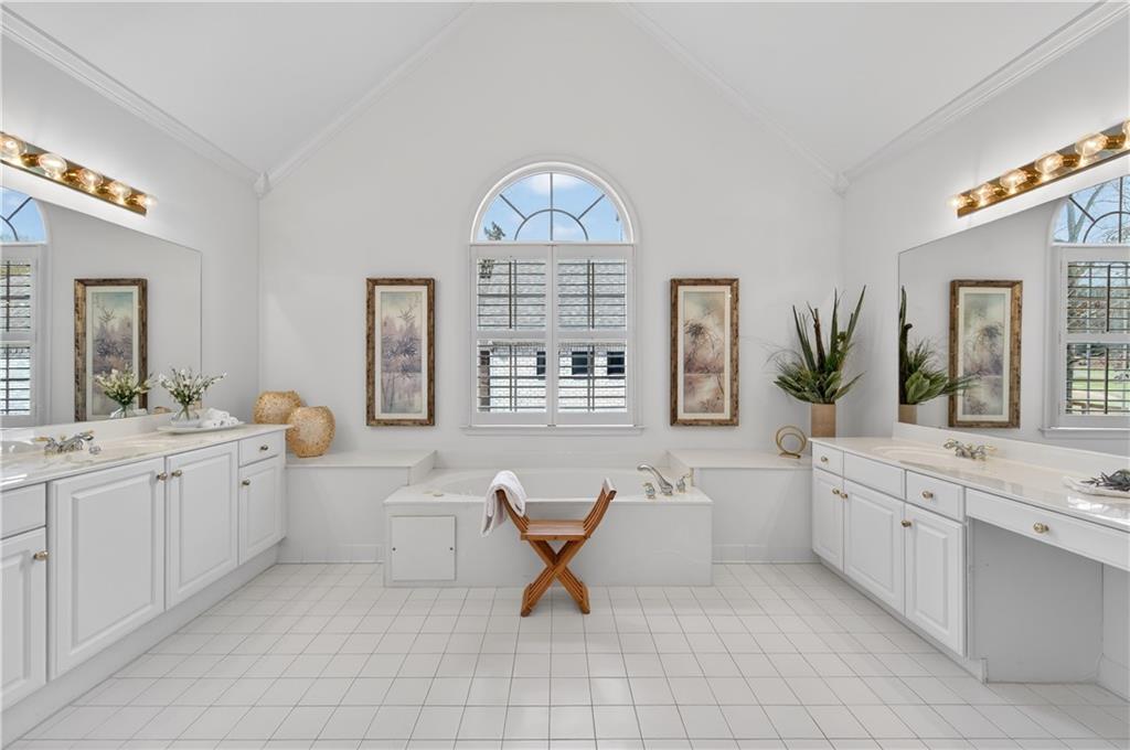 6460 Rutherford Place Suwanee, GA 30024 - Photo 16 of 35 a living room with furniture and a large mirror