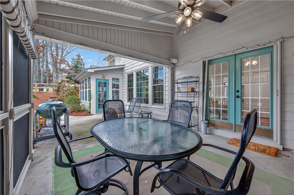 6460 Rutherford Place Suwanee, GA 30024 - Photo 18 of 35 a view of a dining room with furniture window and outside view