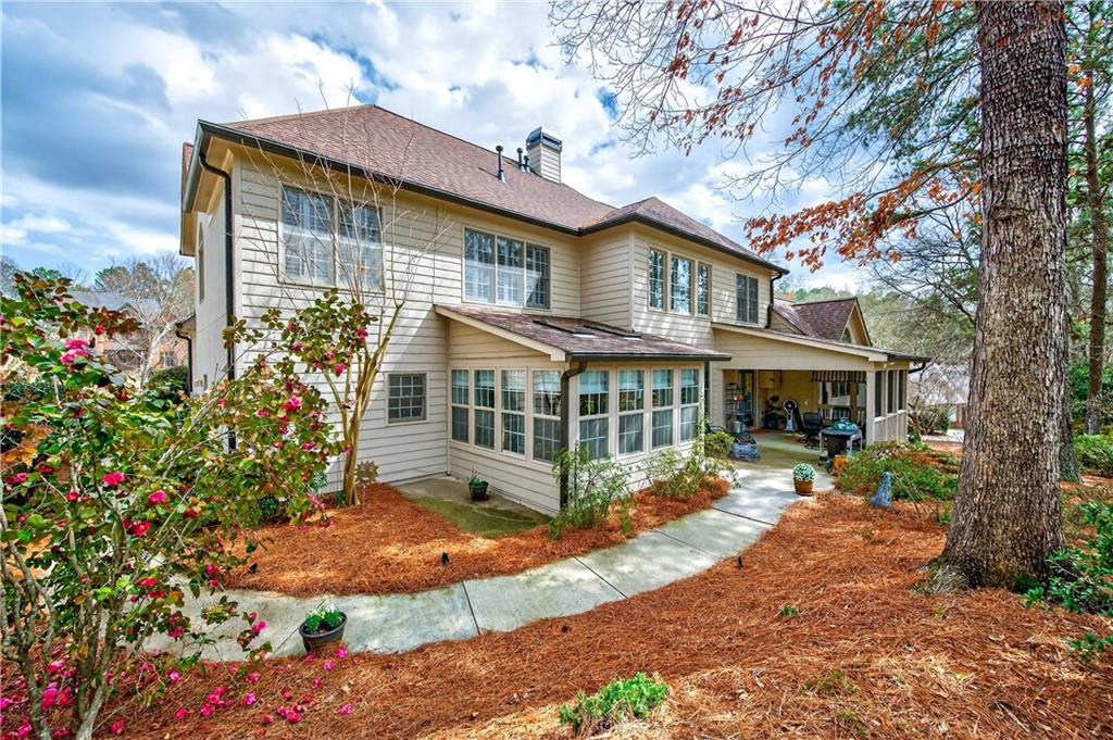 6460 Rutherford Place Suwanee, GA 30024 - Photo 19 of 35 a view of a house with a yard