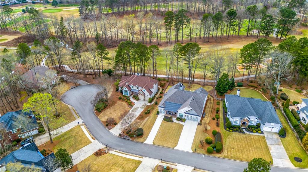 6460 Rutherford Place Suwanee, GA 30024 - Photo 25 of 35 a view of a swimming pool with a patio