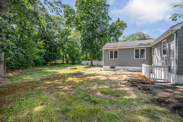 an aerial view of a house with swimming pool garden and patio