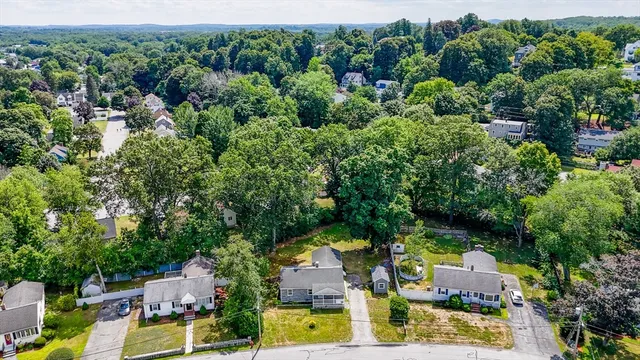 an aerial view of residential houses with outdoor space