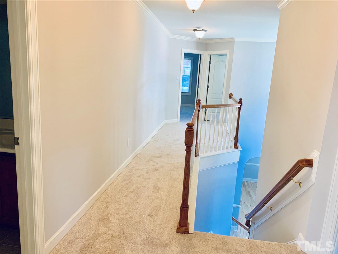 8917 Riverview Park Drive Raleigh, NC 27613 - Photo 15 of 29 a view of staircase with wooden floor and stairs