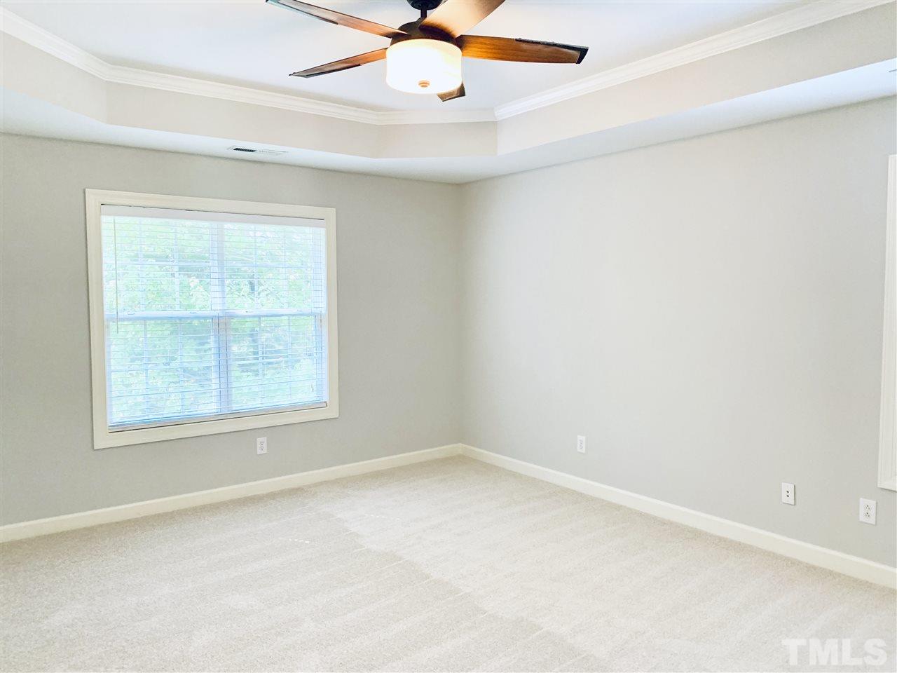 8917 Riverview Park Drive Raleigh, NC 27613 - Photo 16 of 29 an empty room with a window