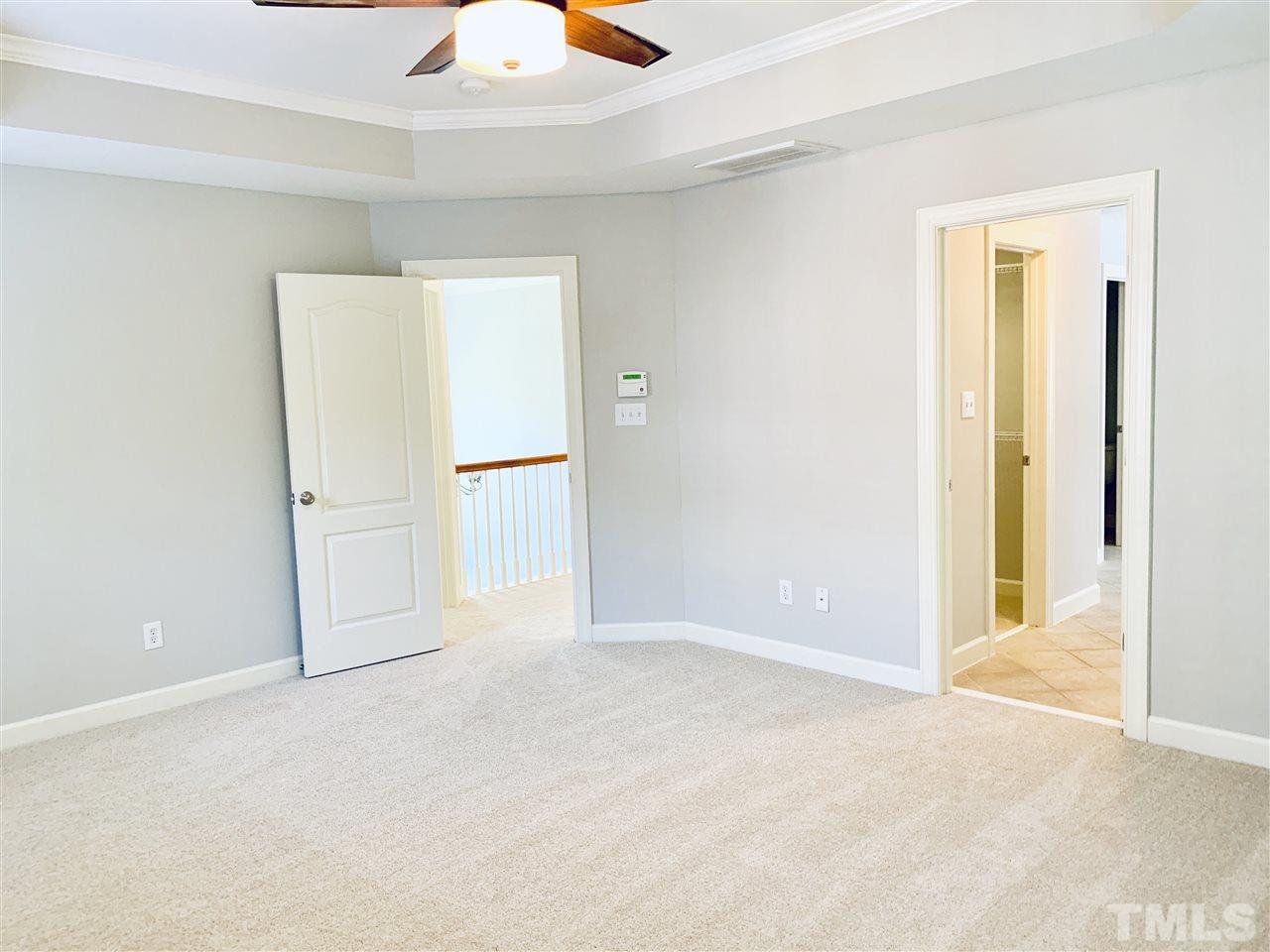 8917 Riverview Park Drive Raleigh, NC 27613 - Photo 17 of 29 an empty room with closet and windows