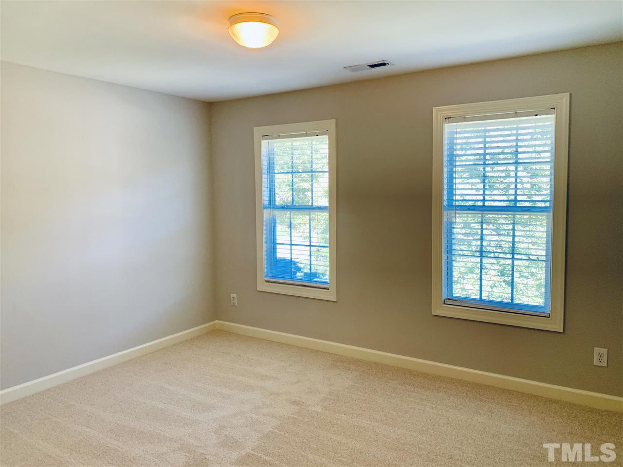 8917 Riverview Park Drive Raleigh, NC 27613 - Photo 21 of 29 an empty room with a window