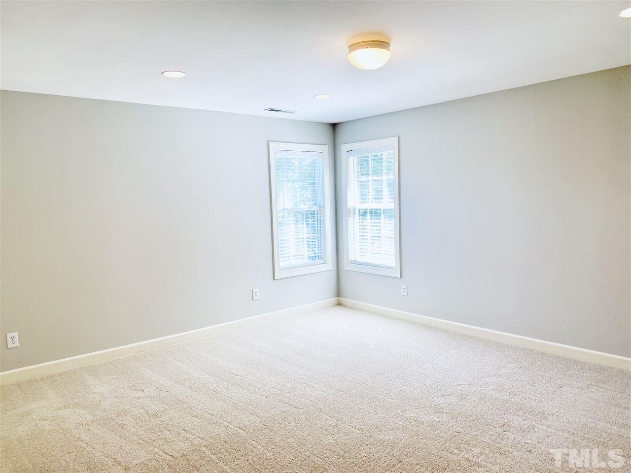 8917 Riverview Park Drive Raleigh, NC 27613 - Photo 22 of 29 an empty room with windows and closet