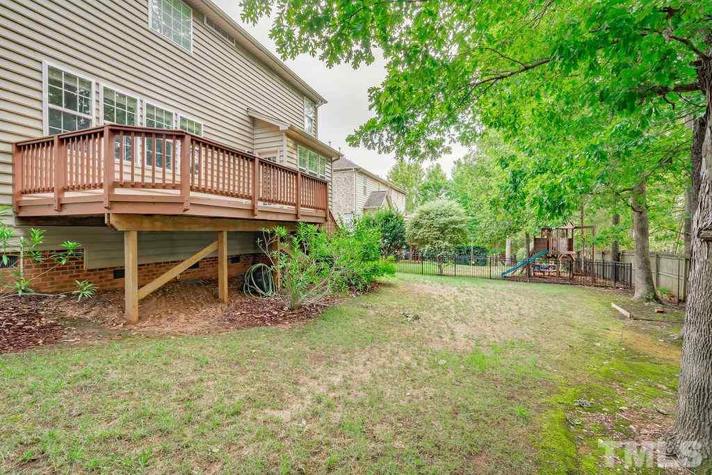 8917 Riverview Park Drive Raleigh, NC 27613 - Photo 26 of 29 a backyard of a house with table and chairs