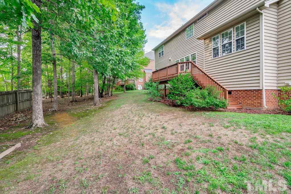 8917 Riverview Park Drive Raleigh, NC 27613 - Photo 29 of 29 a front view of a house with garden