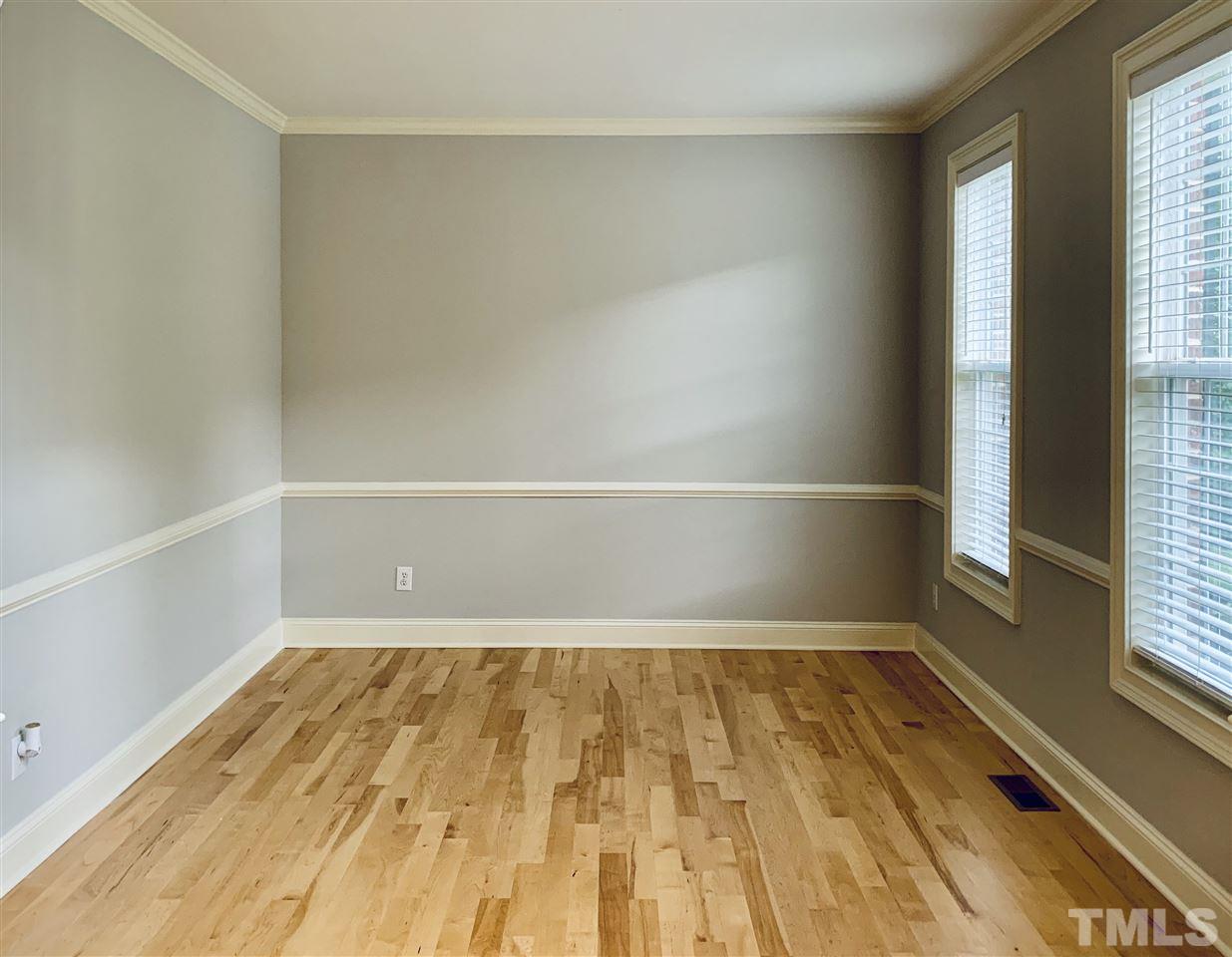 8917 Riverview Park Drive Raleigh, NC 27613 - Photo 6 of 29 a view of a room with wooden floor and small space