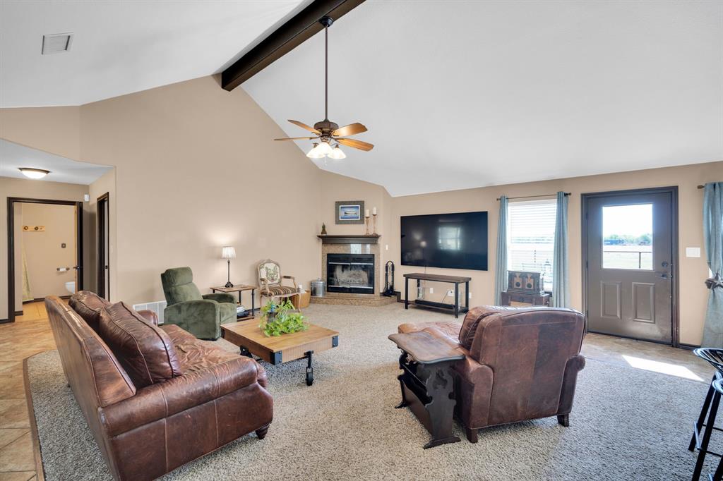 130 Eubanks Road Maypearl, TX 76064 - Photo 17 of 39 a living room with furniture and a flat screen tv