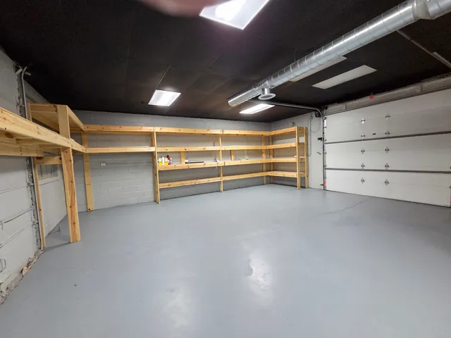 a view of an empty room with a ceiling fan