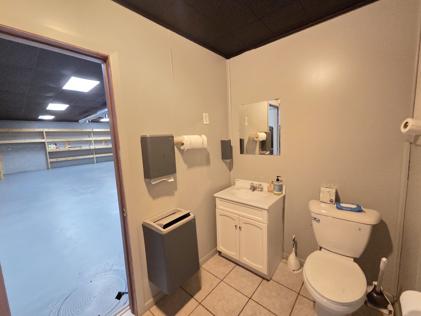 519 Lincoln Avenue Rochelle, IL 61068 - Photo 9 of 20 a bathroom with a toilet sink and mirror