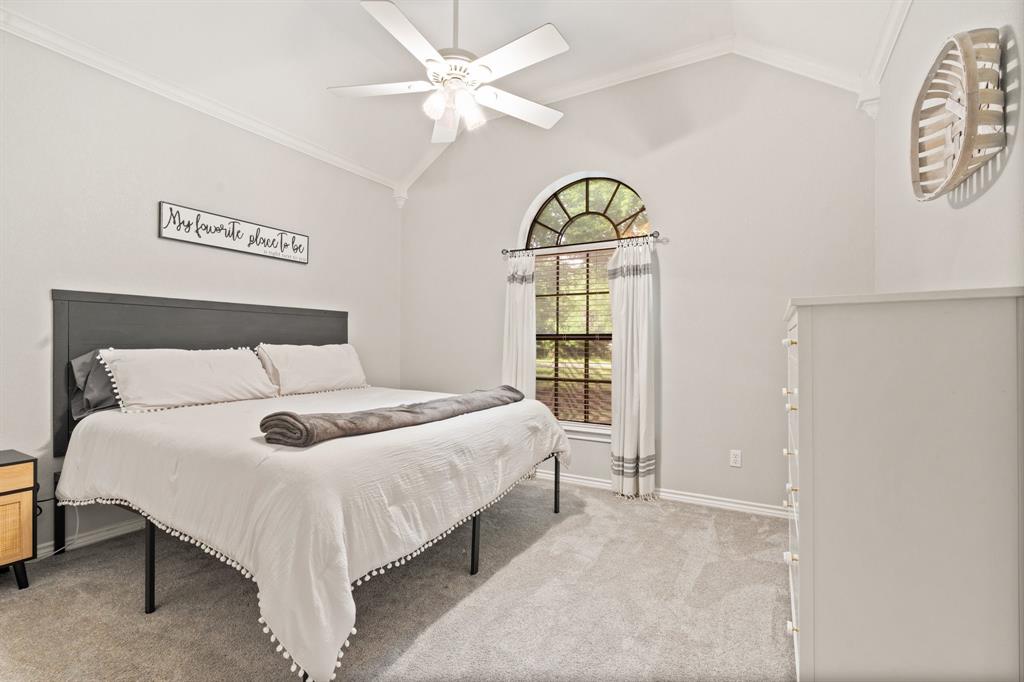 12041 Shady Creek Drive Whitney, TX 76692 - Photo 14 of 40 a bedroom with a bed and a window