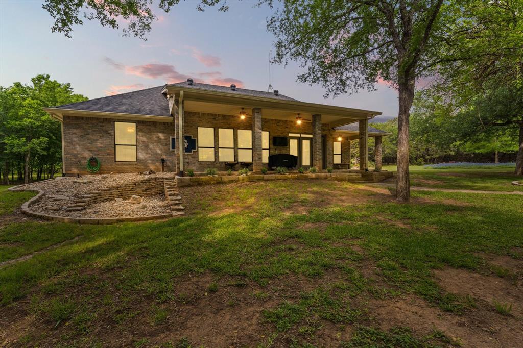 12041 Shady Creek Drive Whitney, TX 76692 - Photo 21 of 40 a front view of a house with a yard
