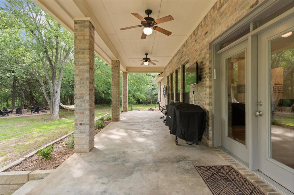 12041 Shady Creek Drive Whitney, TX 76692 - Photo 25 of 40 a view of a porch and garden