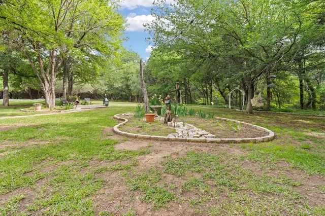a view of a fountain in front of a house