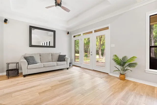 a living room with furniture and a large window