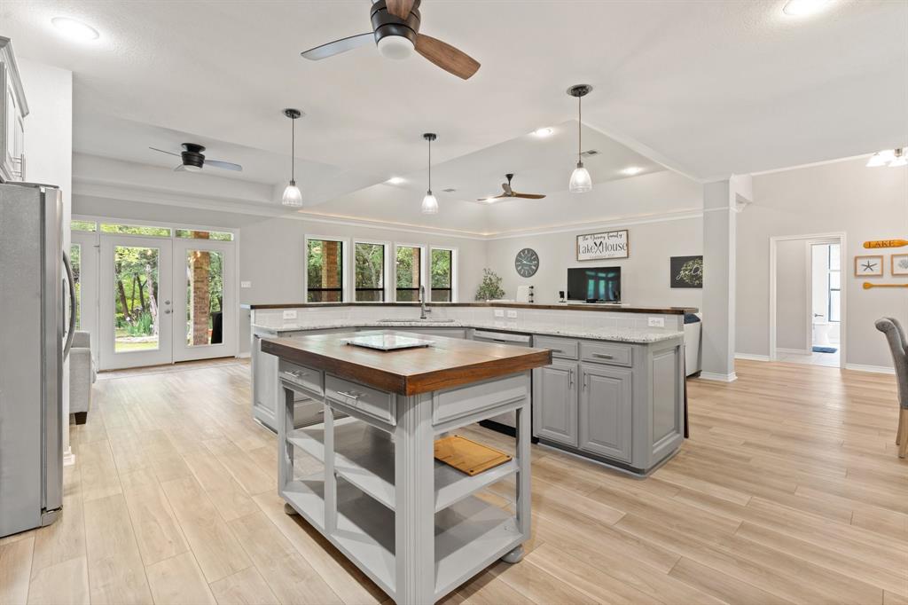 12041 Shady Creek Drive Whitney, TX 76692 - Photo 7 of 40 a kitchen with a stove and a wooden floor